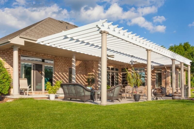 A pergola attached to a house