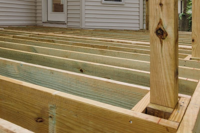 Timber deck frame under construction with joists and support post